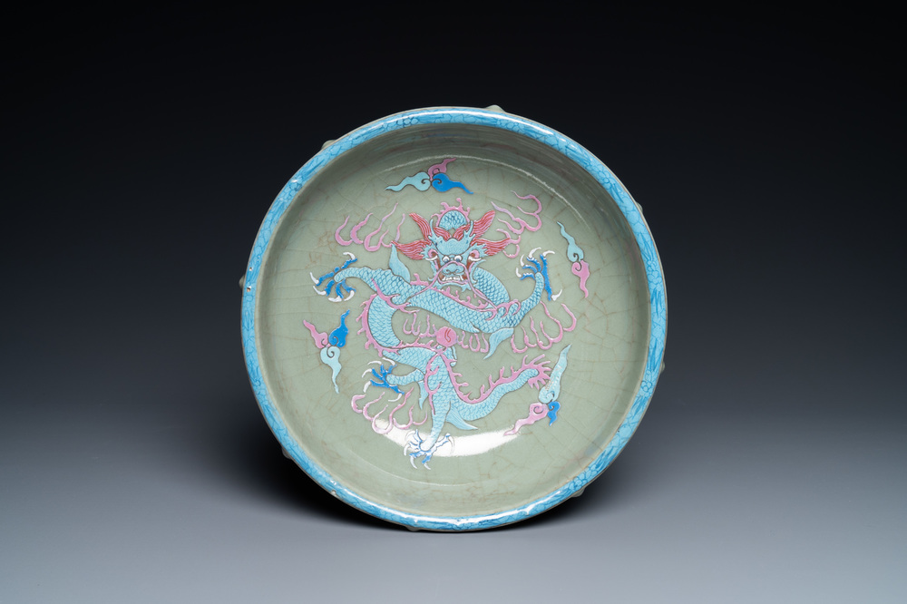 A Chinese enamelled celadon-glazed censer with a dragon on a lotus-shaped wooden stand, Qing