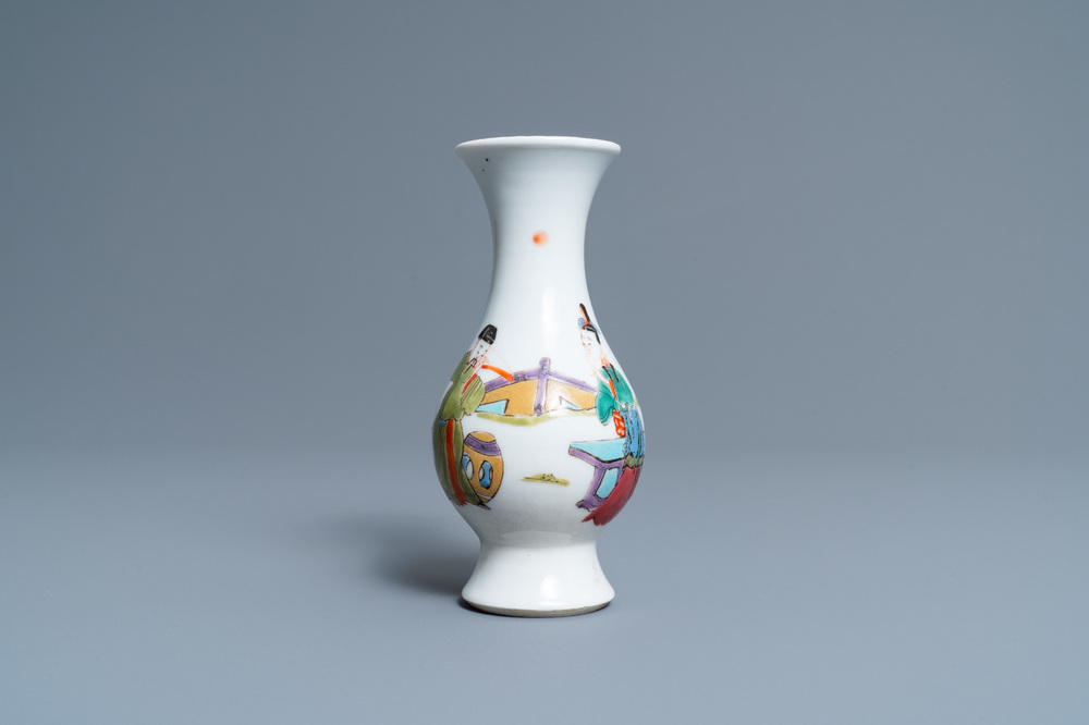 A Chinese famille rose vase with a man and a woman in a garden, Yongzheng