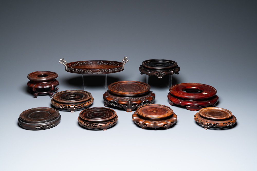 A varied collection of Chinese wooden stands and a silver-mounted tray, 19/20th C.