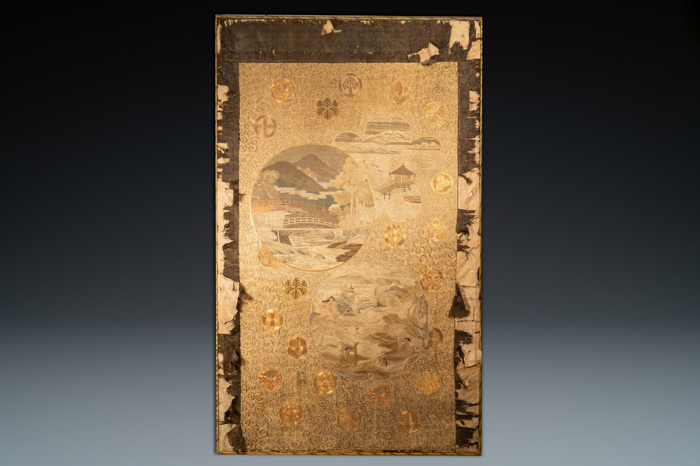 A large Japanese silk embroidery with landscape medallions, Meiji, 19th C.