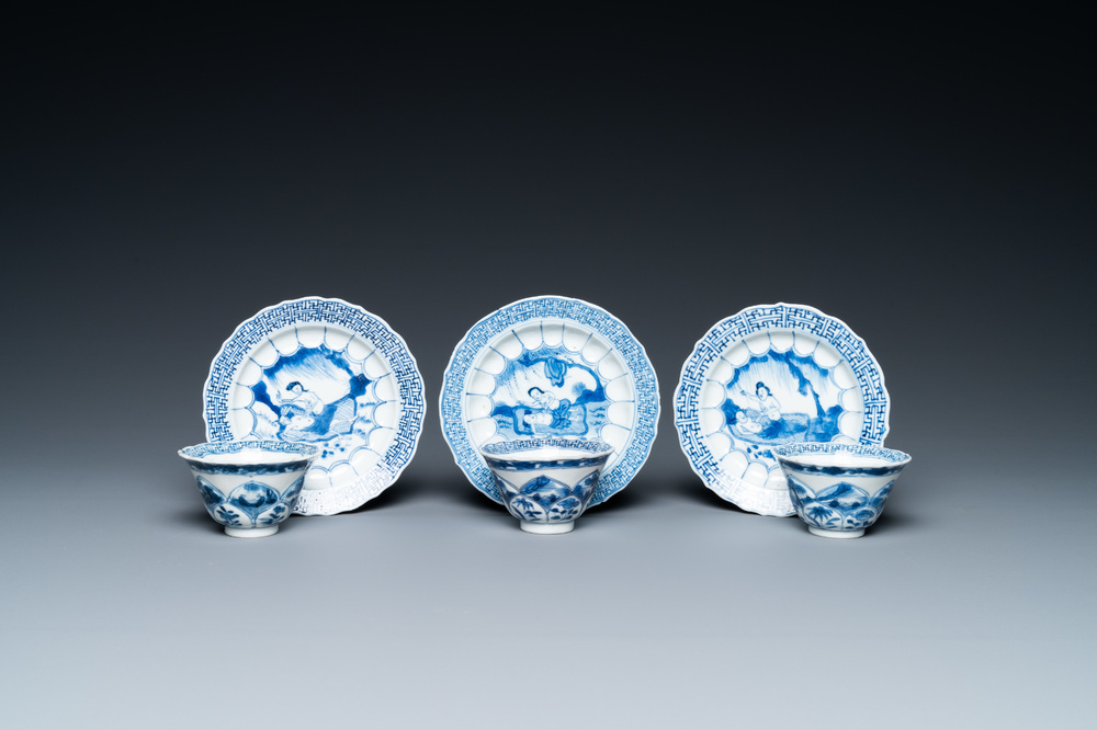 Three Chinese blue and white lotus-shaped 'acupuncture' cups and saucers, Kangxi