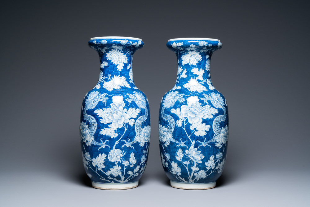 A pair of Chinese blue and white 'dragon and peony' vases, 19th C.