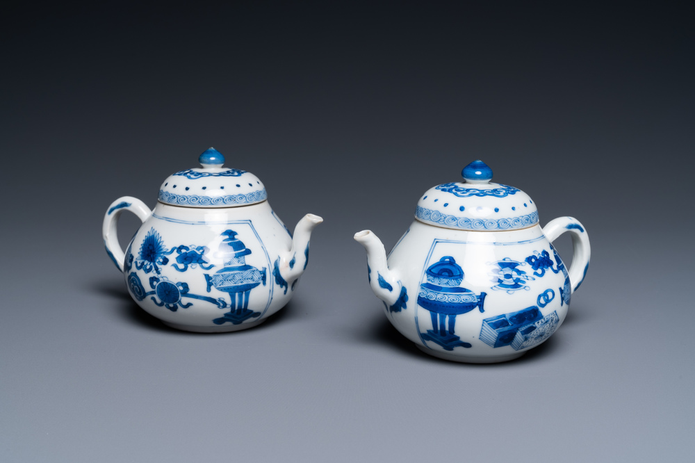A pair of Chinese blue and white 'antiquities' teapots, Kangxi