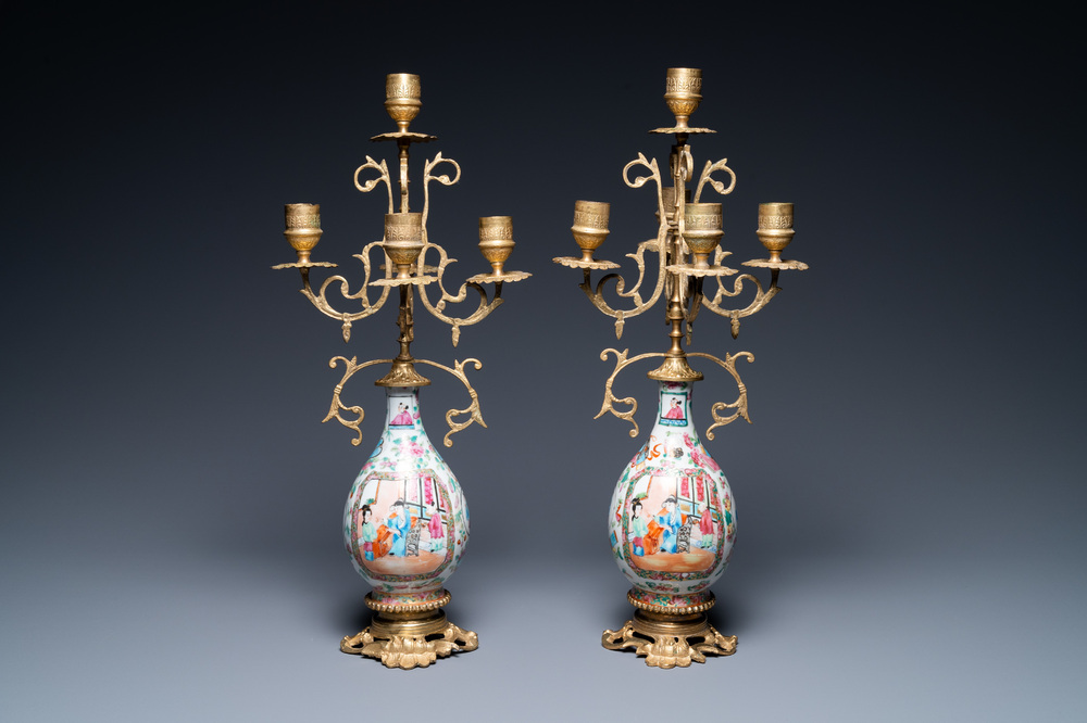 A pair of Chinese gilt brass candelabra-mounted Canton famille rose vases, 19th C.