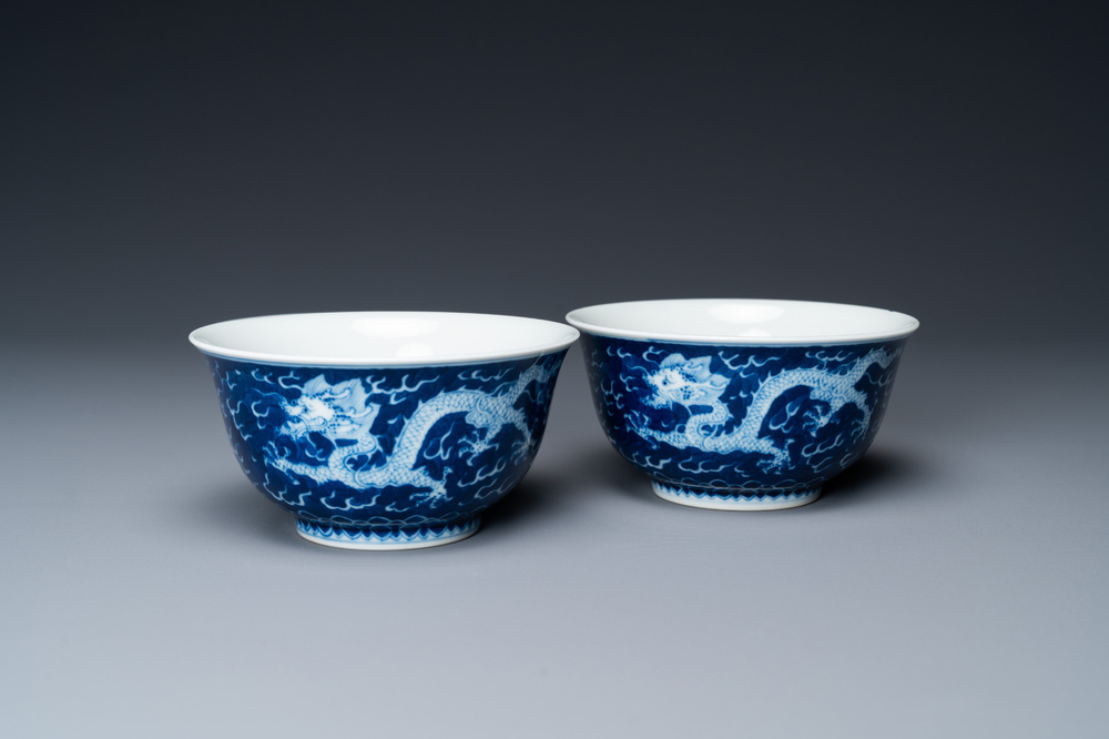 A pair of Chinese blue and white 'dragon' bowls, Kangxi mark, 19/20th C.