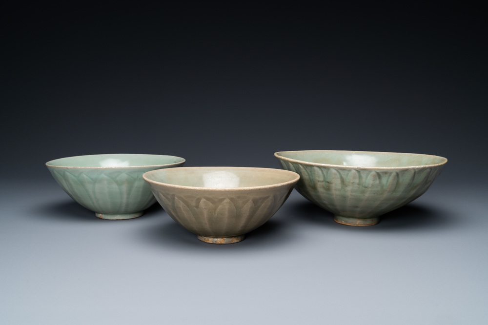 Three Chinese celadon-glazed 'lotus' bowls, Song