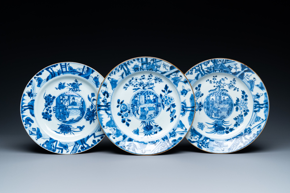Three Chinese blue and white dishes with raised central medallions, Kangxi