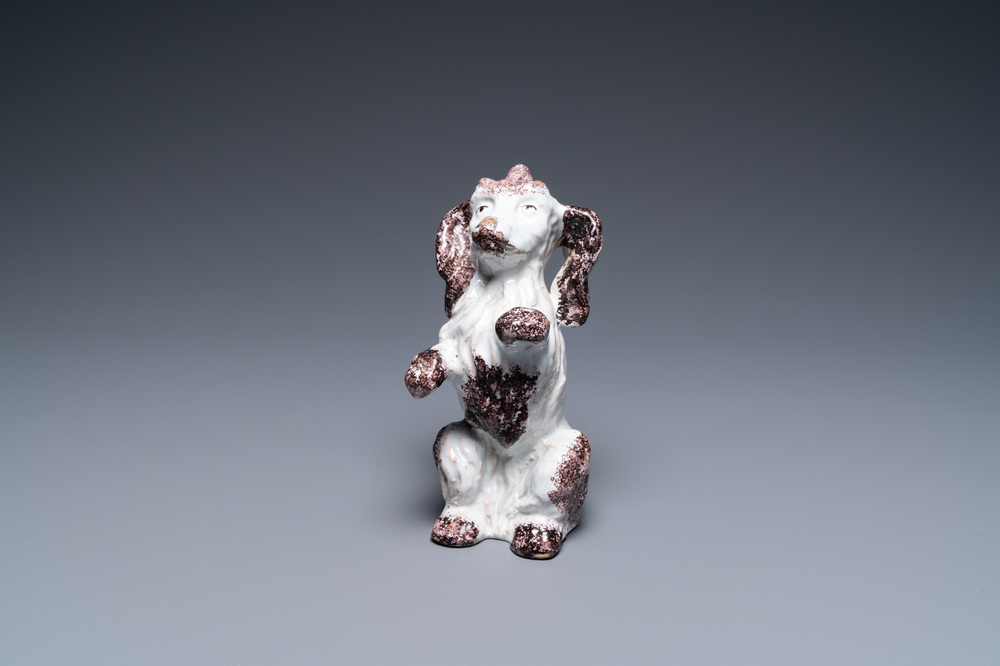 A Brussels faience manganese and white dog, 18th C.