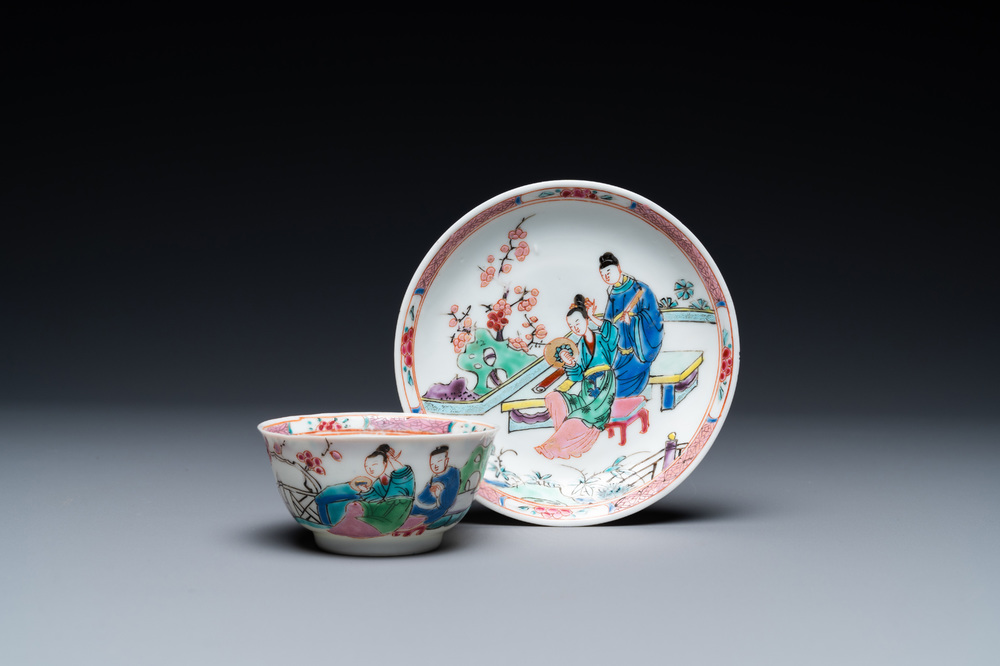 A Chinese famille rose cup and saucer with a couple on a terrace, Qianlong