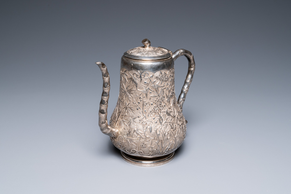 A Chinese silver teapot with birds among blossoming branches, 19th C.