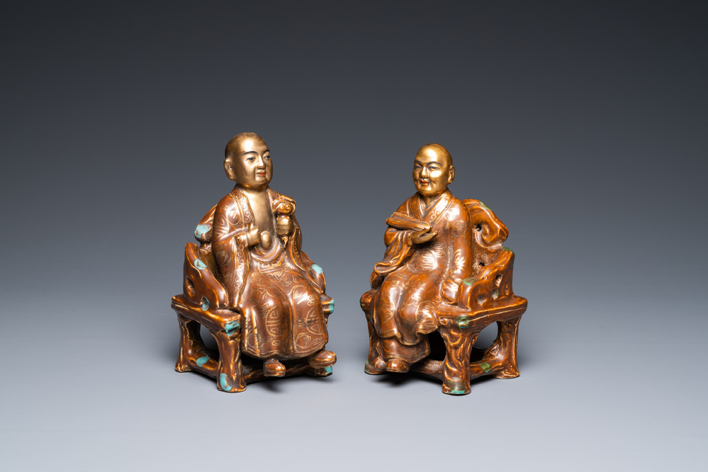 A pair of Chinese partly gilded seated figures, Zeng Long Sheng Zao mark, 20th C.