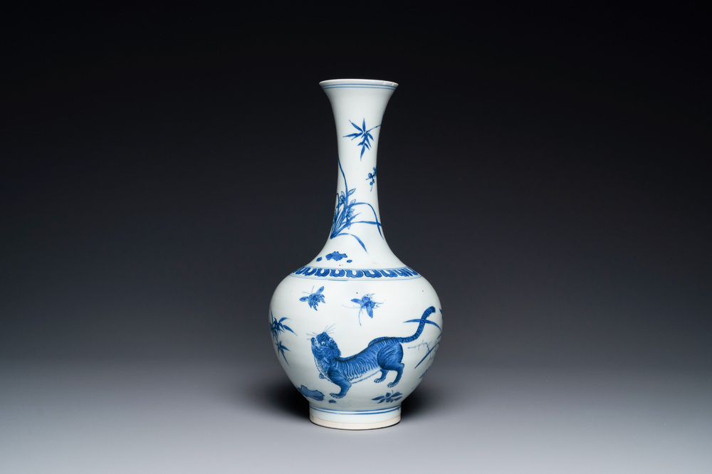 A rare Chinese blue and white bottle vase with a tiger and two butterflies, Transitional period
