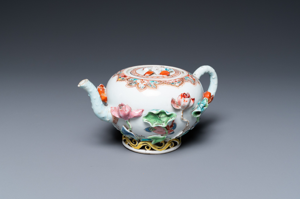A Chinese famille rose teapot with applied floral design, Yongzheng