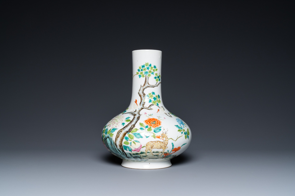 A Chinese famille rose bottle vase with a deer and cranes, 19/20th C.