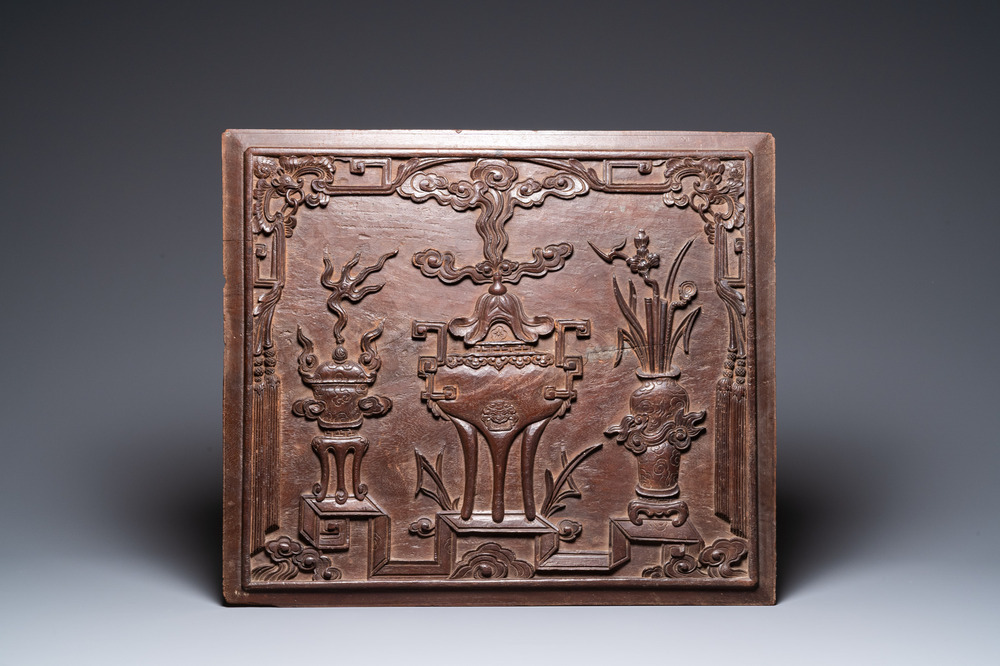 A Chinese carved wooden 'antiquities' panel, 19th C.