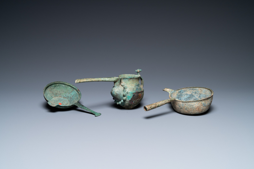 Two Luristan bronze pouring bowls and a spouted vessel, Iran, 1st millenium BC