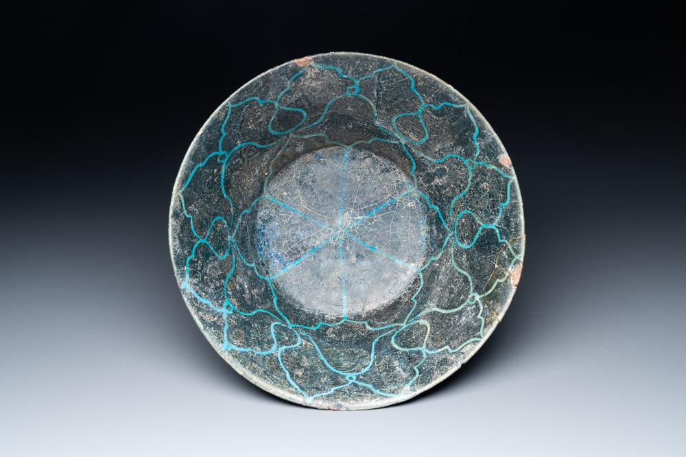 A turquoise- and black-glazed bowl, Kashan, Iran, 12/13th C.