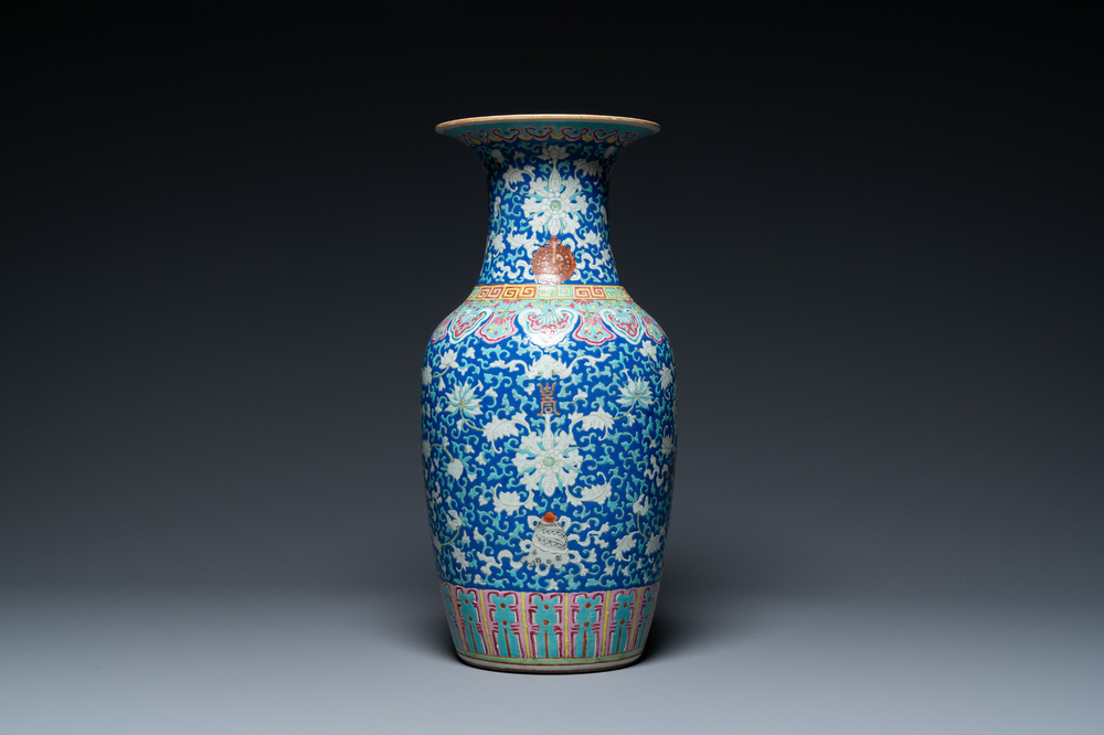 A Chinese famille rose blue-ground 'bajixiang' vase, 19th C.