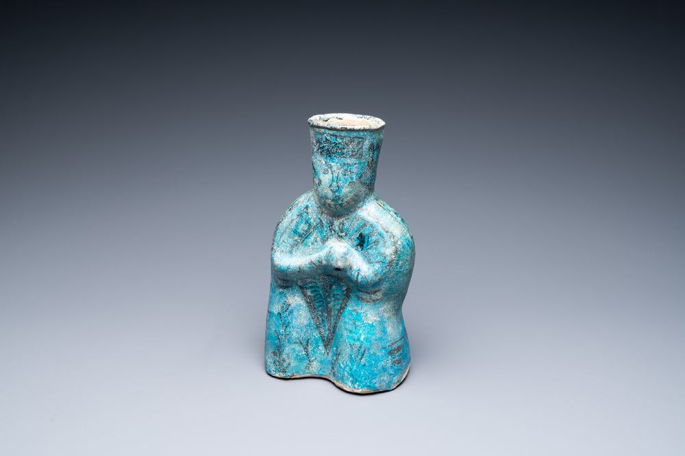 A turquoise- and black-glazed pottery figurative ewer, Kashan, Iran, 12/13th C.