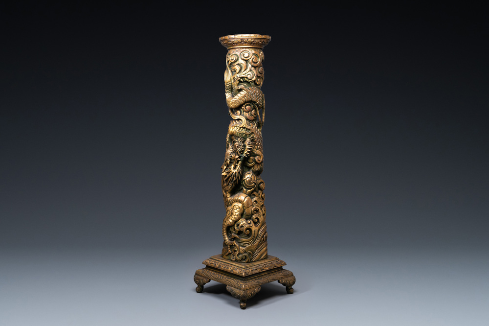 A large Chinese gilded wooden 'dragon' stand, 19th C.