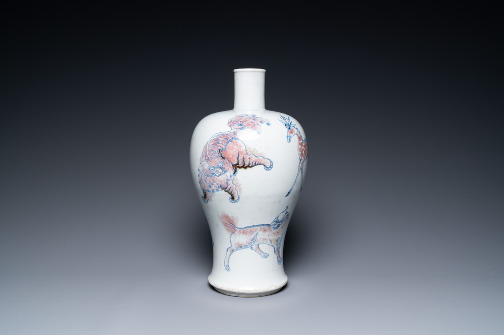 A Chinese blue, white and copper-red 'meiping' vase with mythical animals, Qianlong mark, 18/19th C.