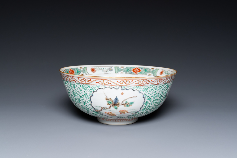A Chinese famille verte relief-decorated bowl with squirrels and rabbits, Kangxi