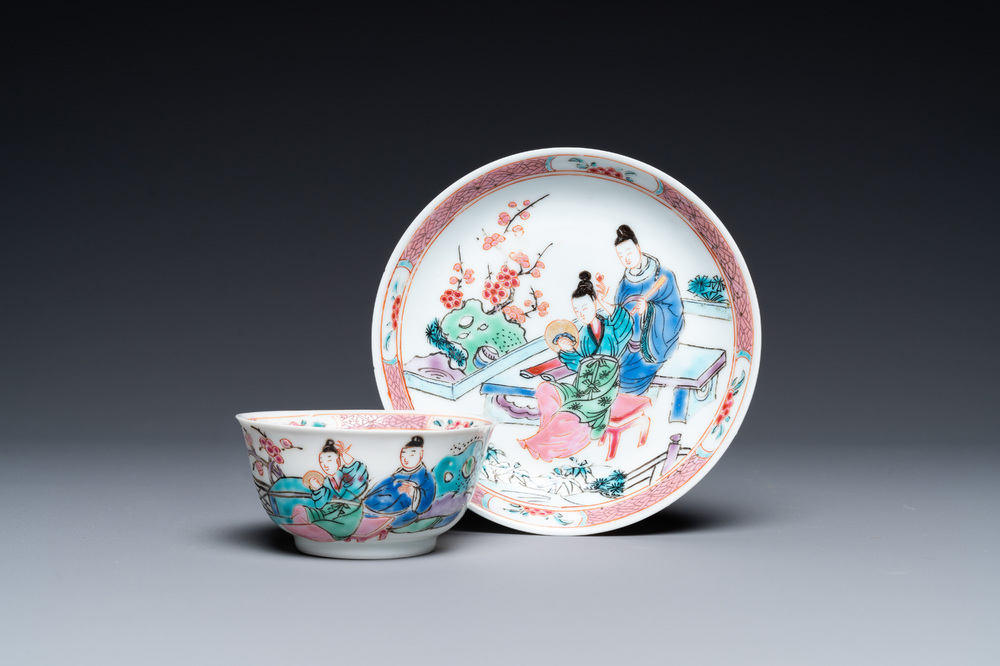 A Chinese famille rose cup and saucer with a couple on a terrace, Qianlong