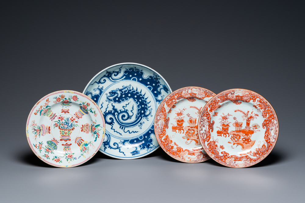 A Chinese blue and white 'dragon' dish and three iron-red and famille rose plates, 18th C.