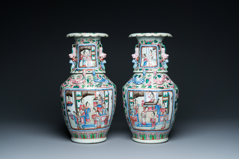 A pair of Chinese famille rose 'court scene' vases, 19th C.