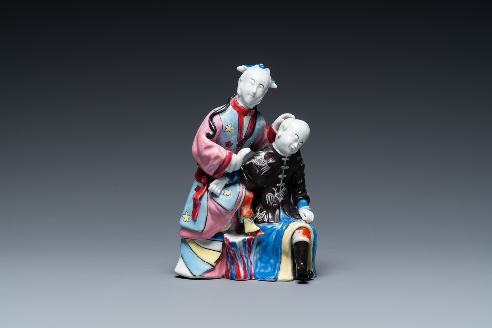 A Chinese famille rose 'ear cleaning' group, Qianlong