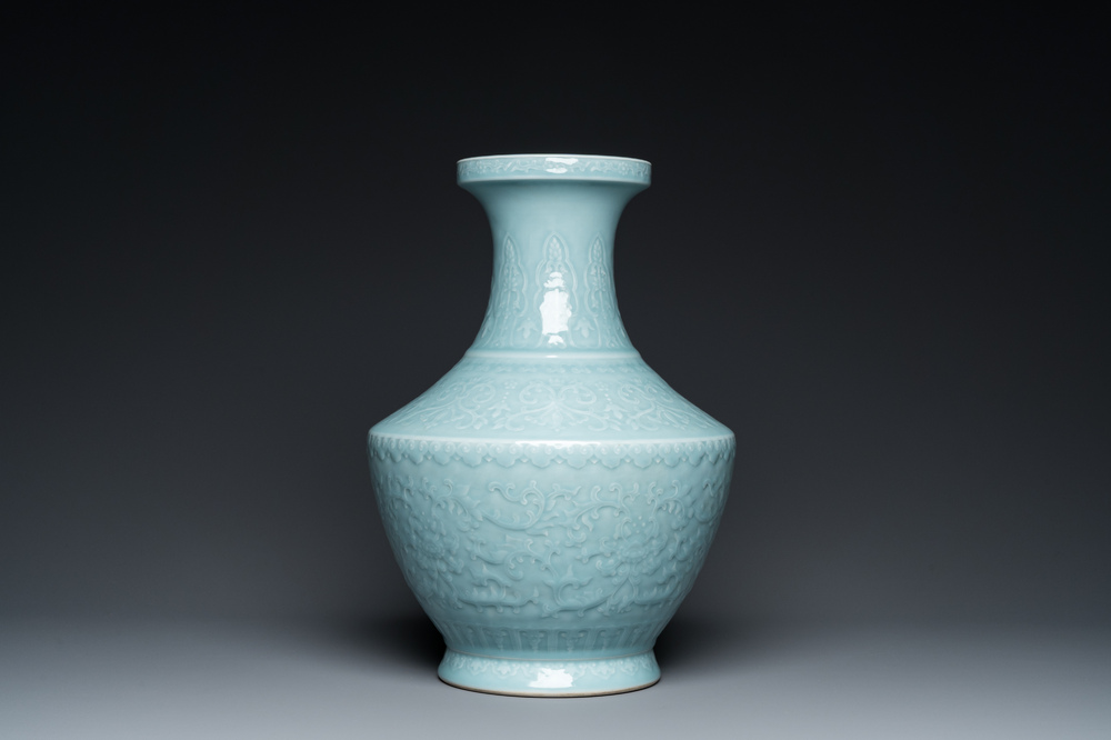 A Chinese monochrome claire-de-lune-glazed 'lotus scroll' vase, 'hu', Qianlong mark but probably later