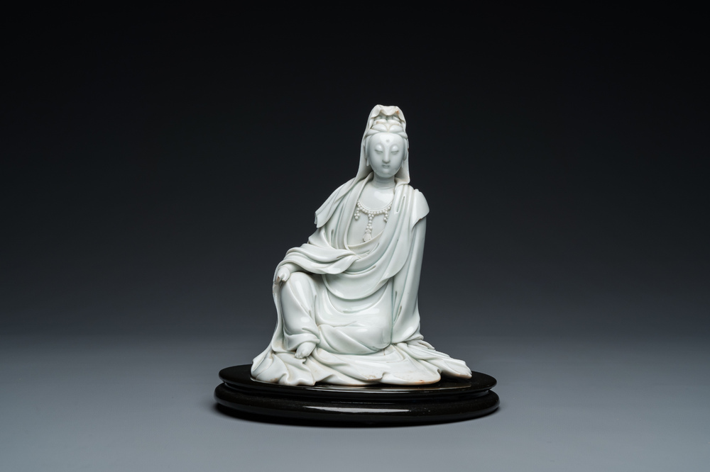 A Chinese Dehua blanc de Chine figure of Guanyin, He Zhang Yong Yin 何章用印 mark, Kangxi