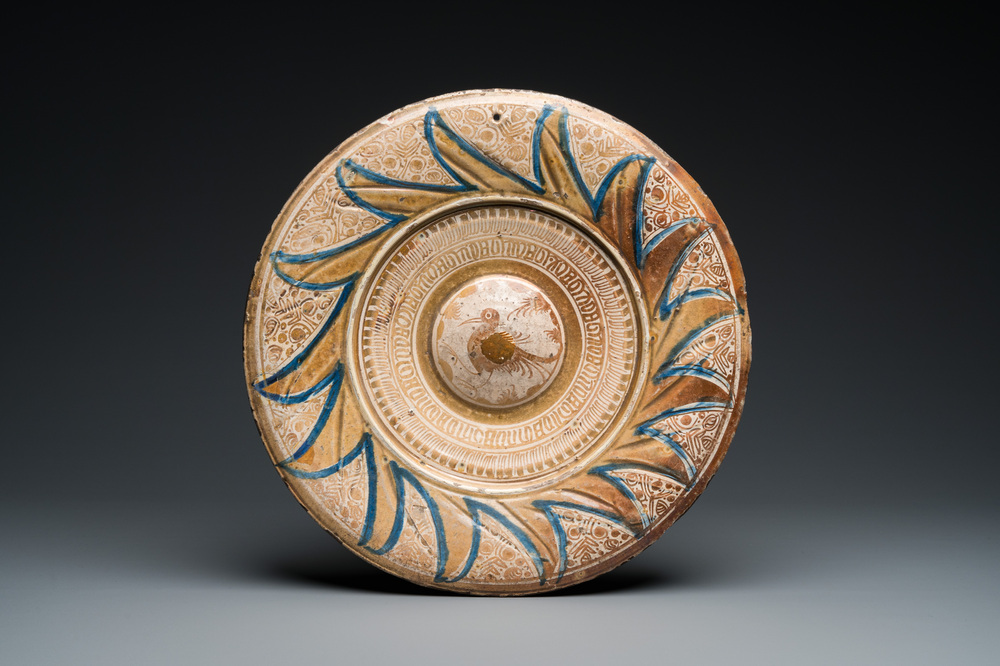 A large Hispano-Moresque lustre-glazed dish with a central bird medallion, Spain, 16th C.