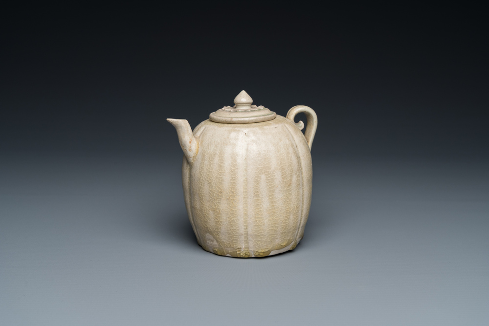 A Vietnamese beige-green-glazed melon-shaped ewer and cover, L&yacute;, 11/13th C.