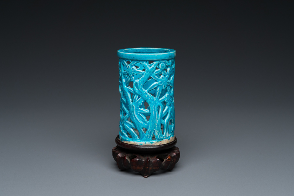 A Chinese reticulated monochrome turquoise brush pot on wooden stand, Qing