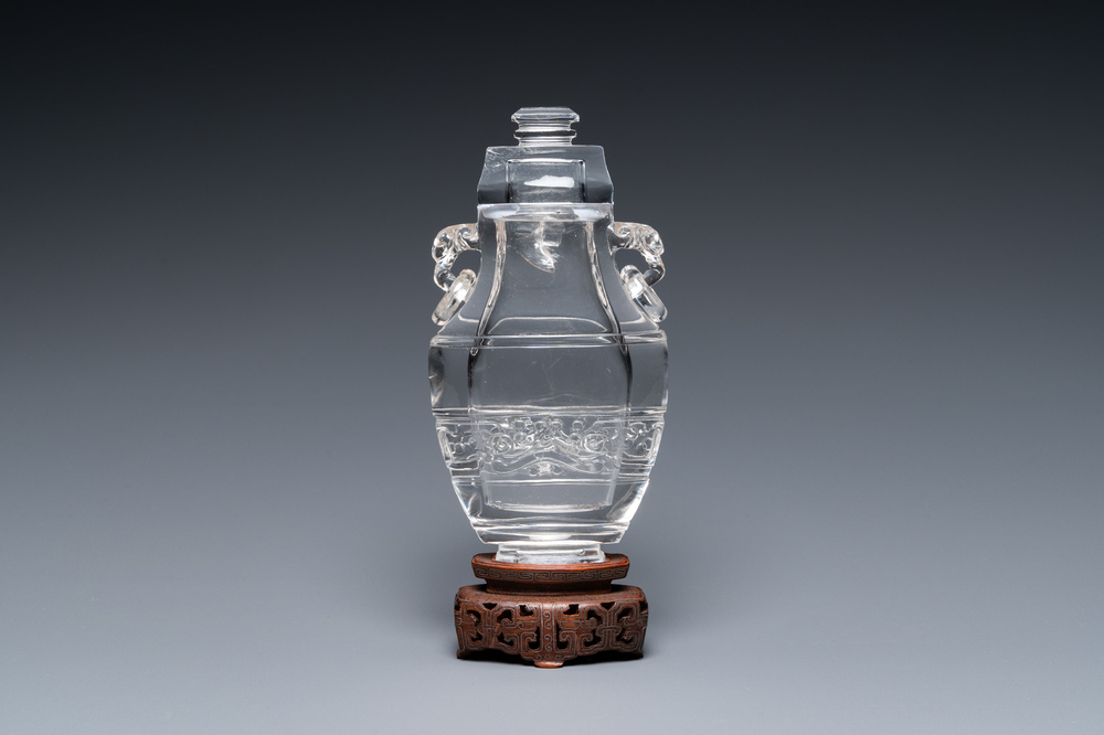 A Chinese rock crystal covered vase on wooden stand, 19/20th C.