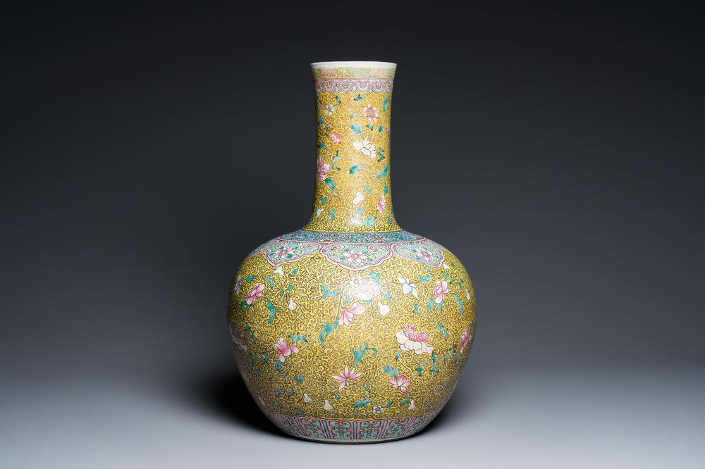 A large Chinese famille rose yellow-ground bottle vase, Qianlong mark, 19th C.