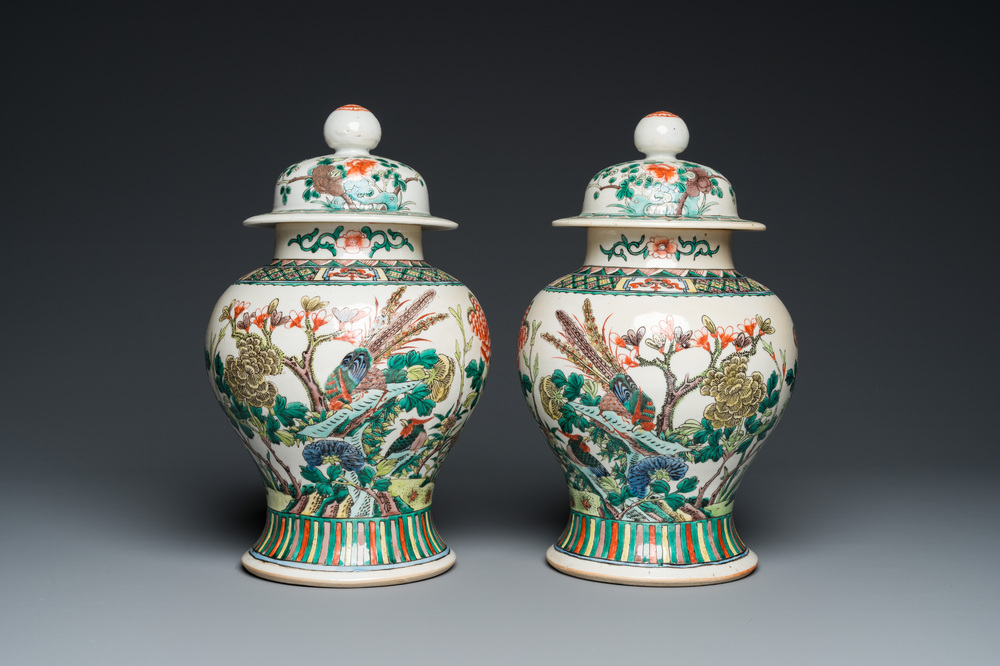 A pair of Chinese Nanking famille verte vases and covers, 19th C.