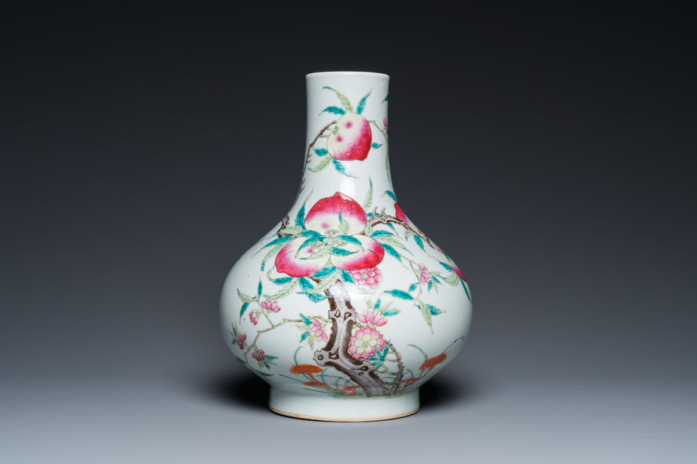 A Chinese famille rose 'nine peaches' bottle vase, 19th C.