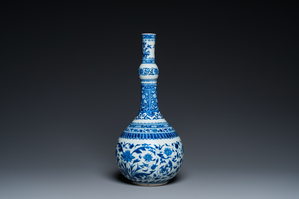 A Chinese blue and white bottle vase with floral design, Kangxi