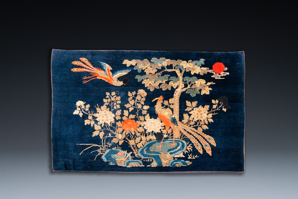 A Chinese blue-ground 'two fenghuang' carpet, 19th C.