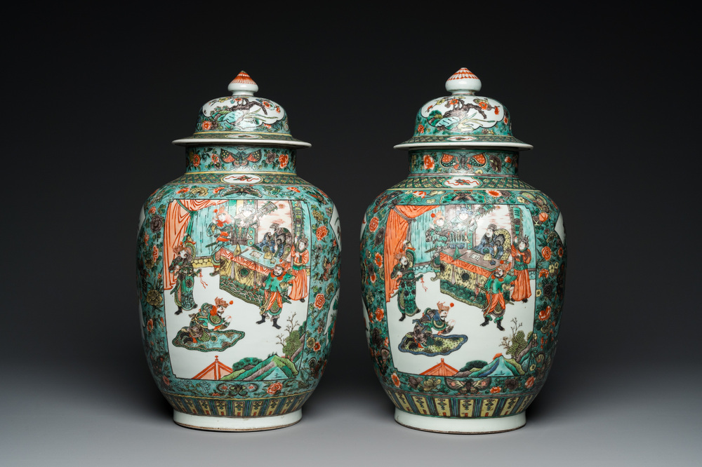 A pair of  Chinese famille verte vases and covers, 19th C.