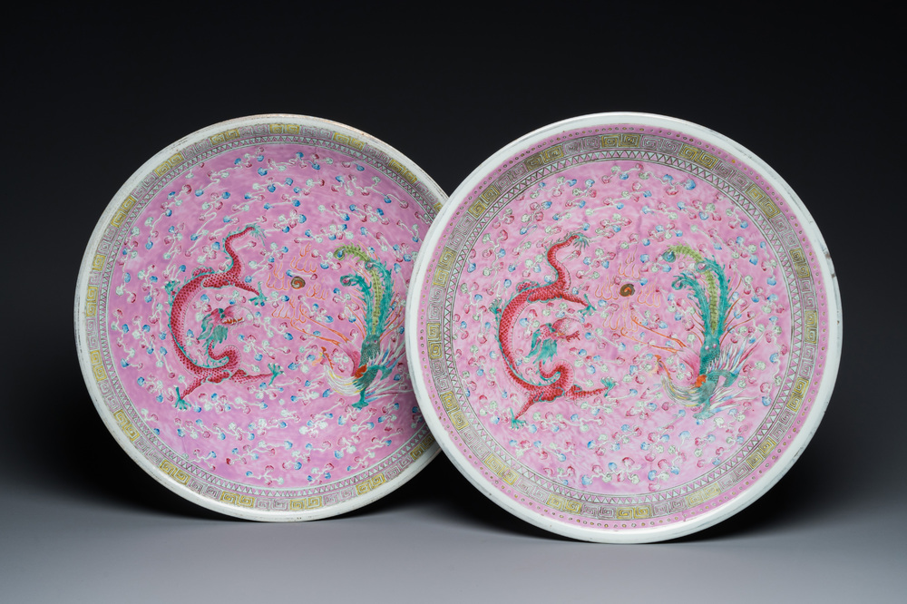 A pair of large Chinese pink-ground famille rose 'dragon and phoenix' dishes, 19th C.