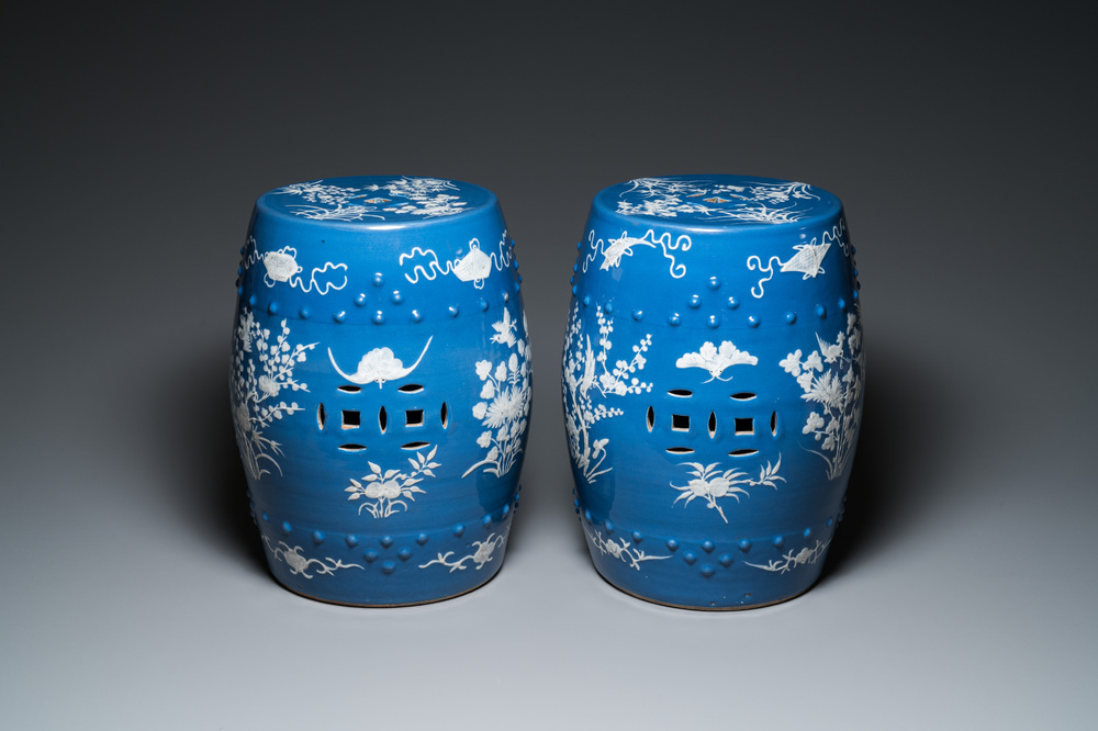 A pair of Chinese white slip-decorated blue-ground garden seats, 19th C.
