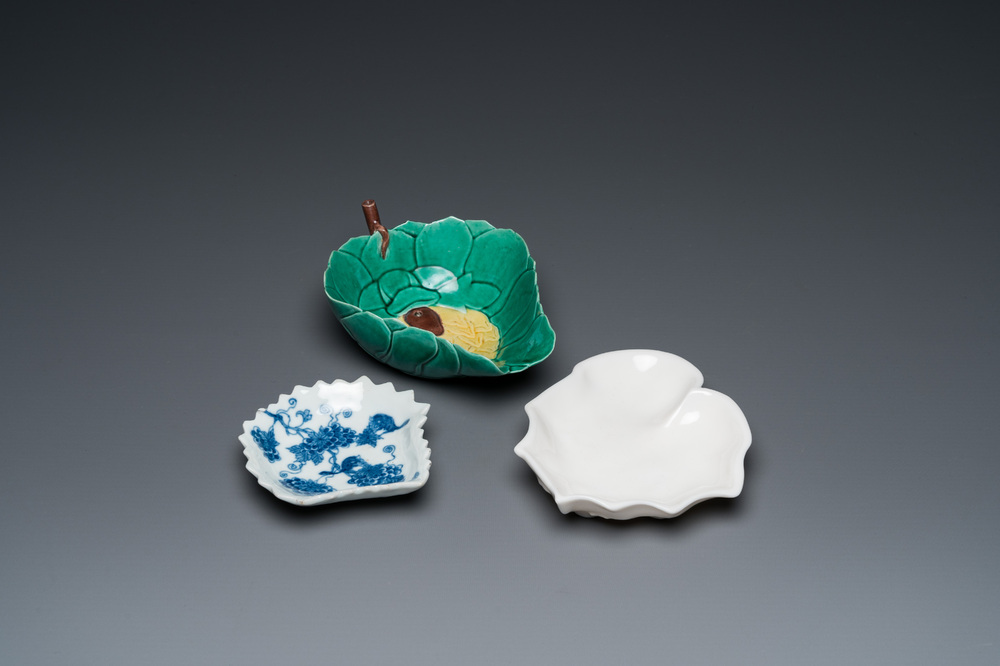 Three Chinese leaf-shaped brush washers in blue and white, blanc de Chine and sancai enamels, 18/19th C.