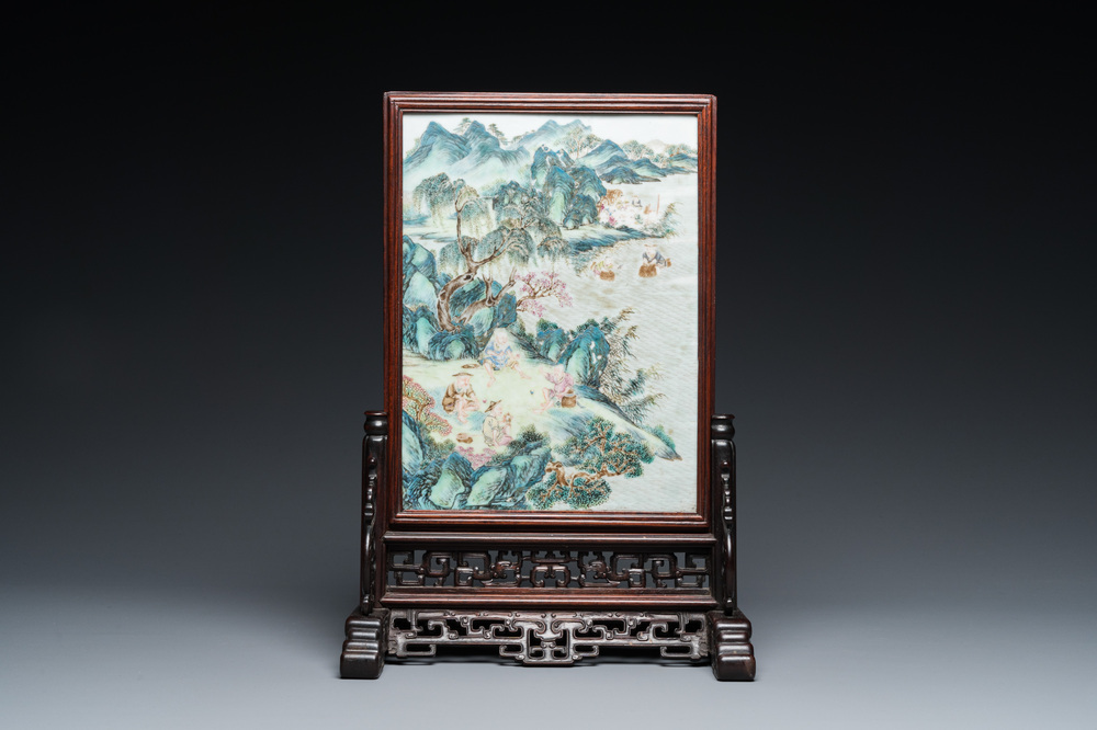 A Chinese famille rose plaque mounted as a table screen, Qianlong