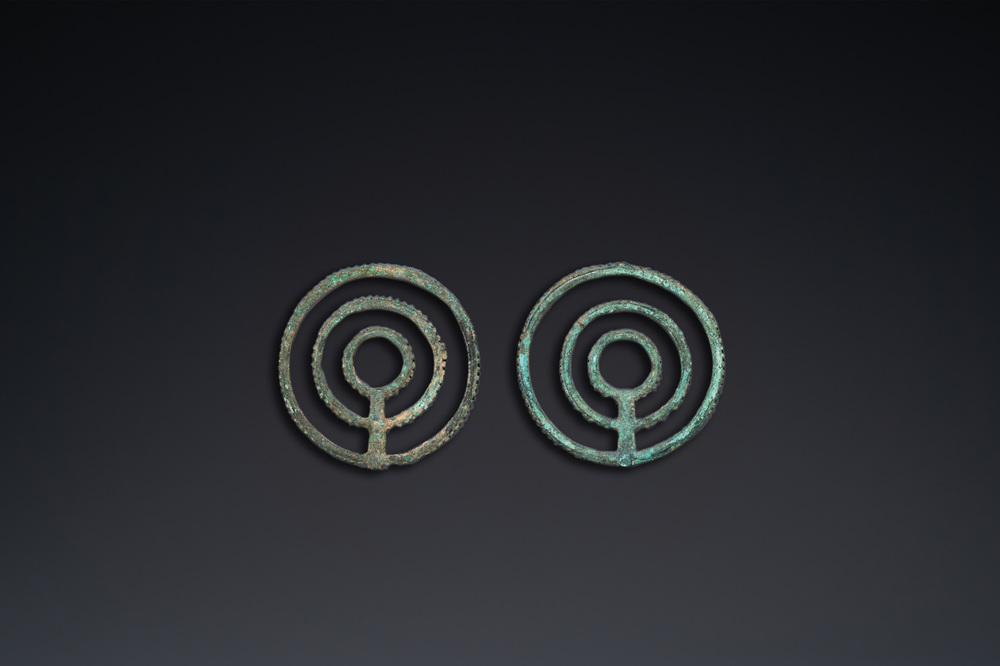 A pair of Chinese bronze bridle ornaments, Western Zhou, ca. 8th C. b.C.