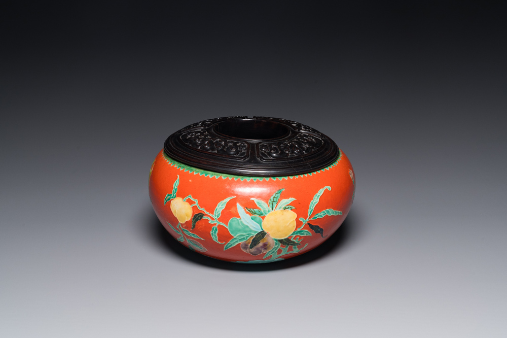 A Chinese relief-decorated alms bowl with wooden lid, Qianlong mark, 19/20th C.