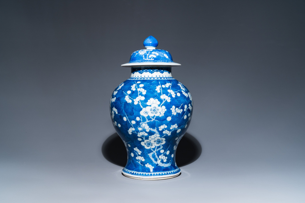A Chinese blue and white 'prunus on cracked ice' vase and cover, Kangxi