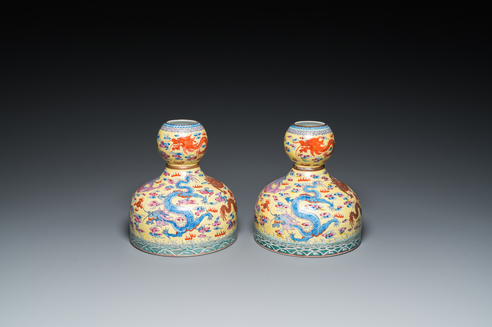 A pair of Chinese famille rose yellow-ground 'dragon' vases, Qianlong mark, 20th C.